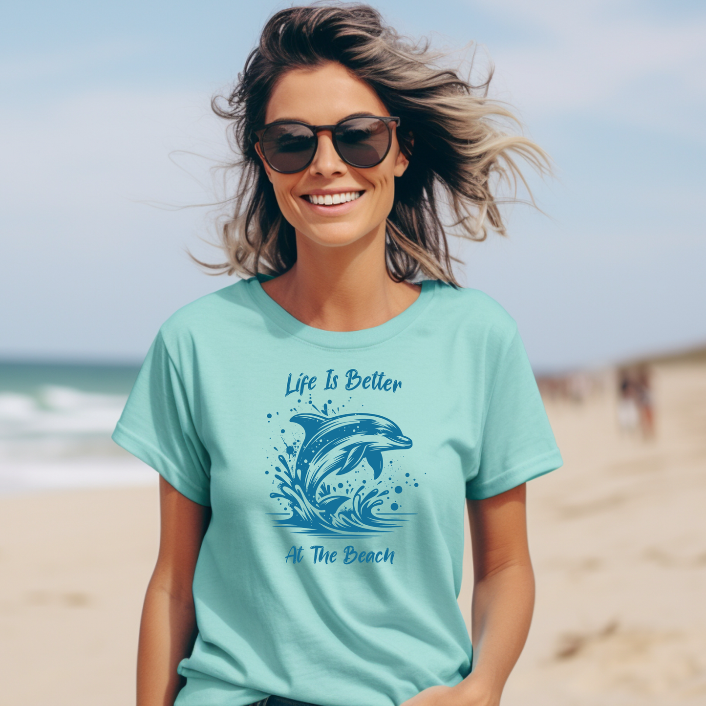 Comfort Colors 1717 "Life is Better at the Beach" t shirt with a dolphin jumping out of the water in one color graphic. Picture of a girl on the beach in a t shirt.