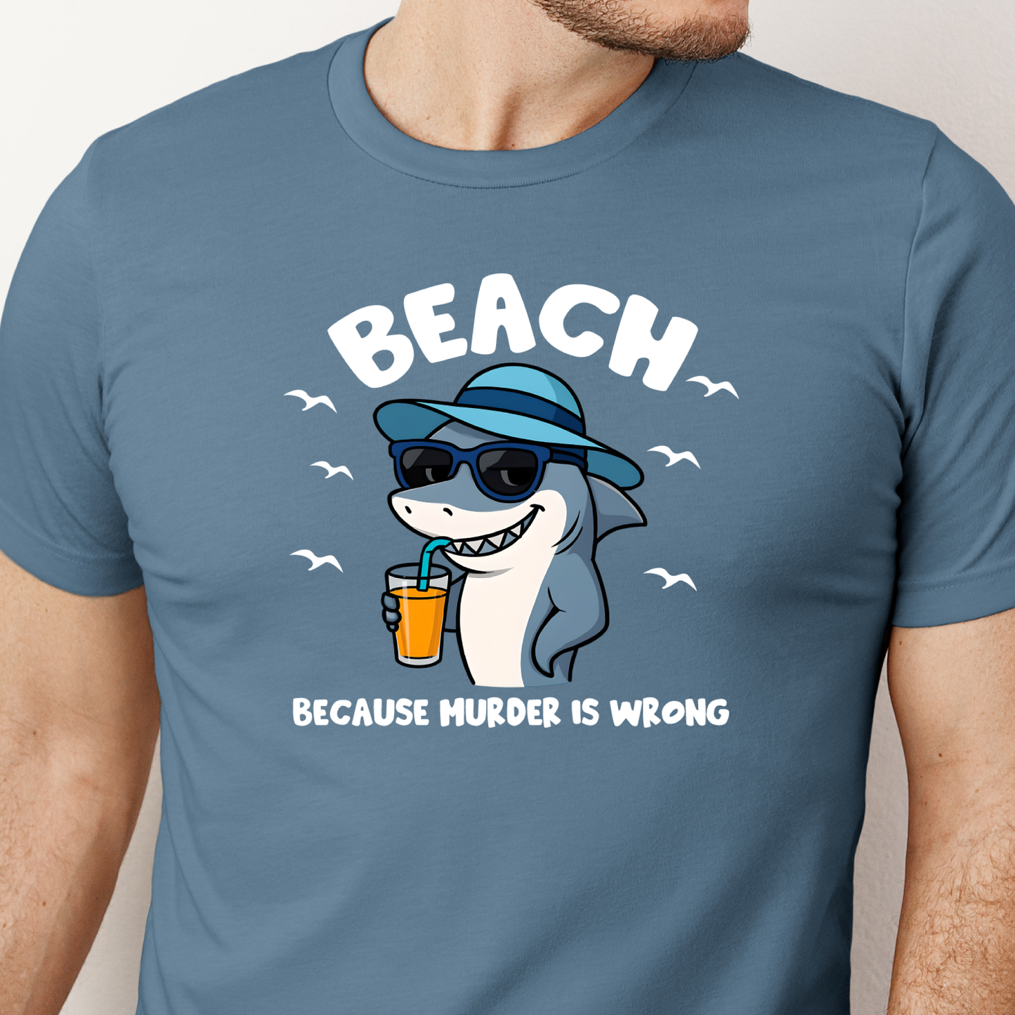 Blue steel t-shirt with a shark graphic and text on a plain background