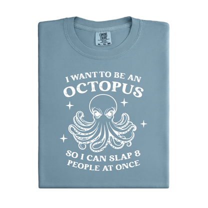 Folded  blue ice  t-shirt with white octopus graphic and text on a white background