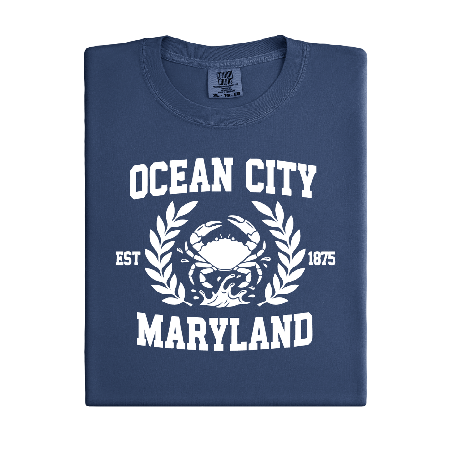 Folded navy blue t-shirt with white 'Ocean City, Maryland' text and crab graphic on a white background