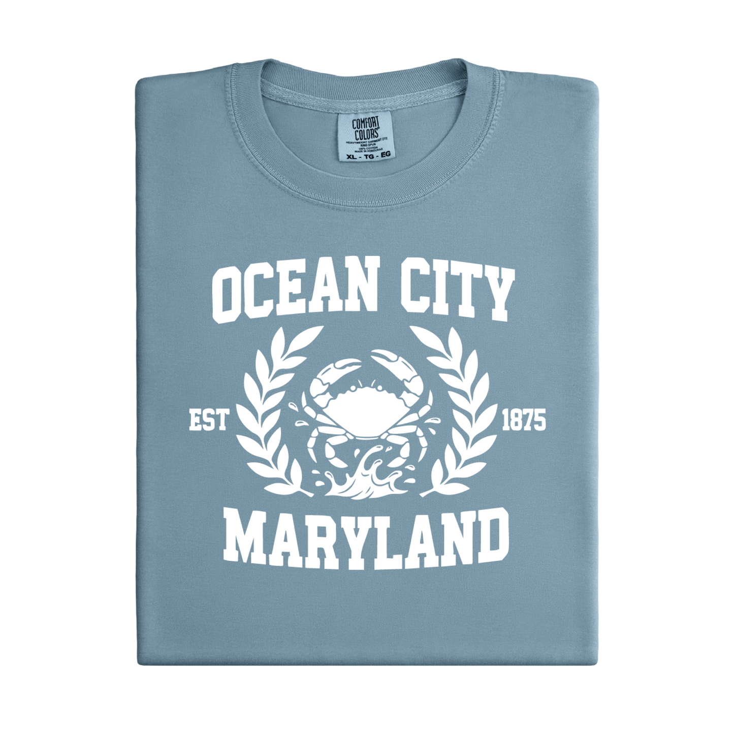 Folded ice blue t-shirt with 'Ocean City, Maryland' text and crab graphic on a white background
