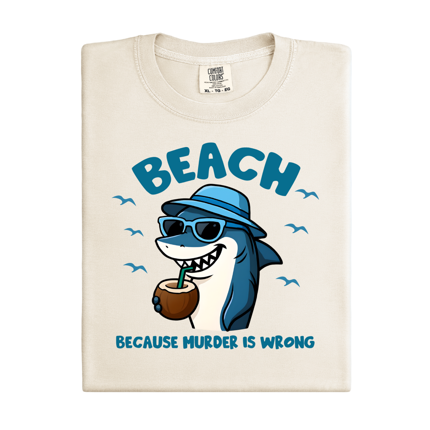 Beach-themed t-shirt with a shark graphic and text on a white background