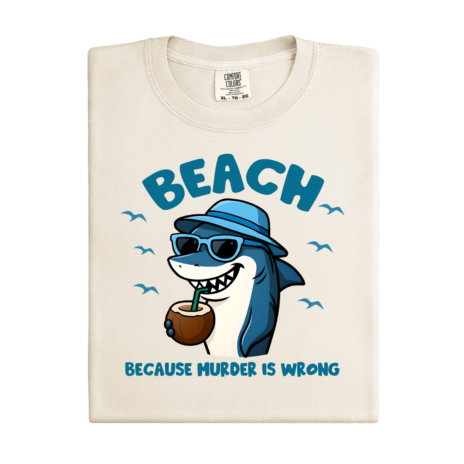 Beach-themed t-shirt with a shark graphic and text on a white background