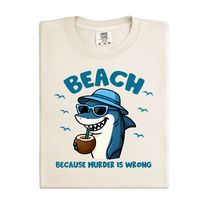 Beach-themed t-shirt with a shark graphic and text on a white background