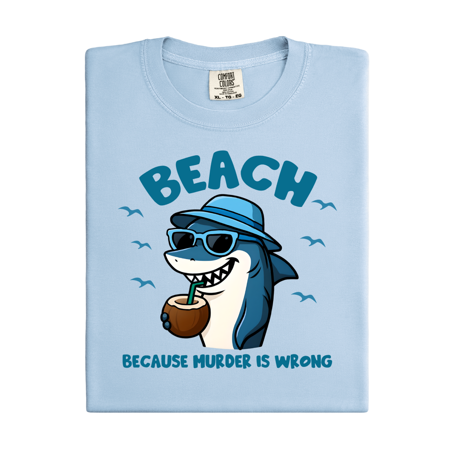 Light blue t-shirt with a cartoon shark design and text on a white background