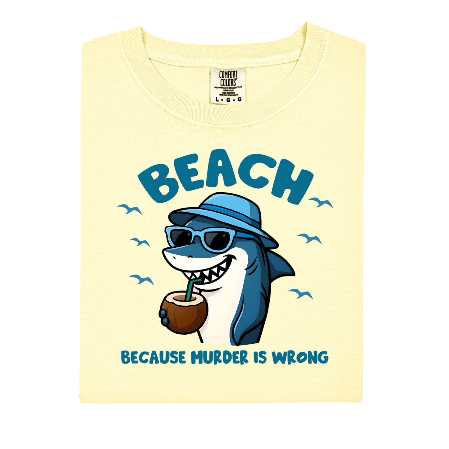 Shirt with a cartoon shark wearing sunglasses and a hat, holding a coconut, and text 'BEACH BECAUSE MURDER IS WRONG' on a light yellow background.