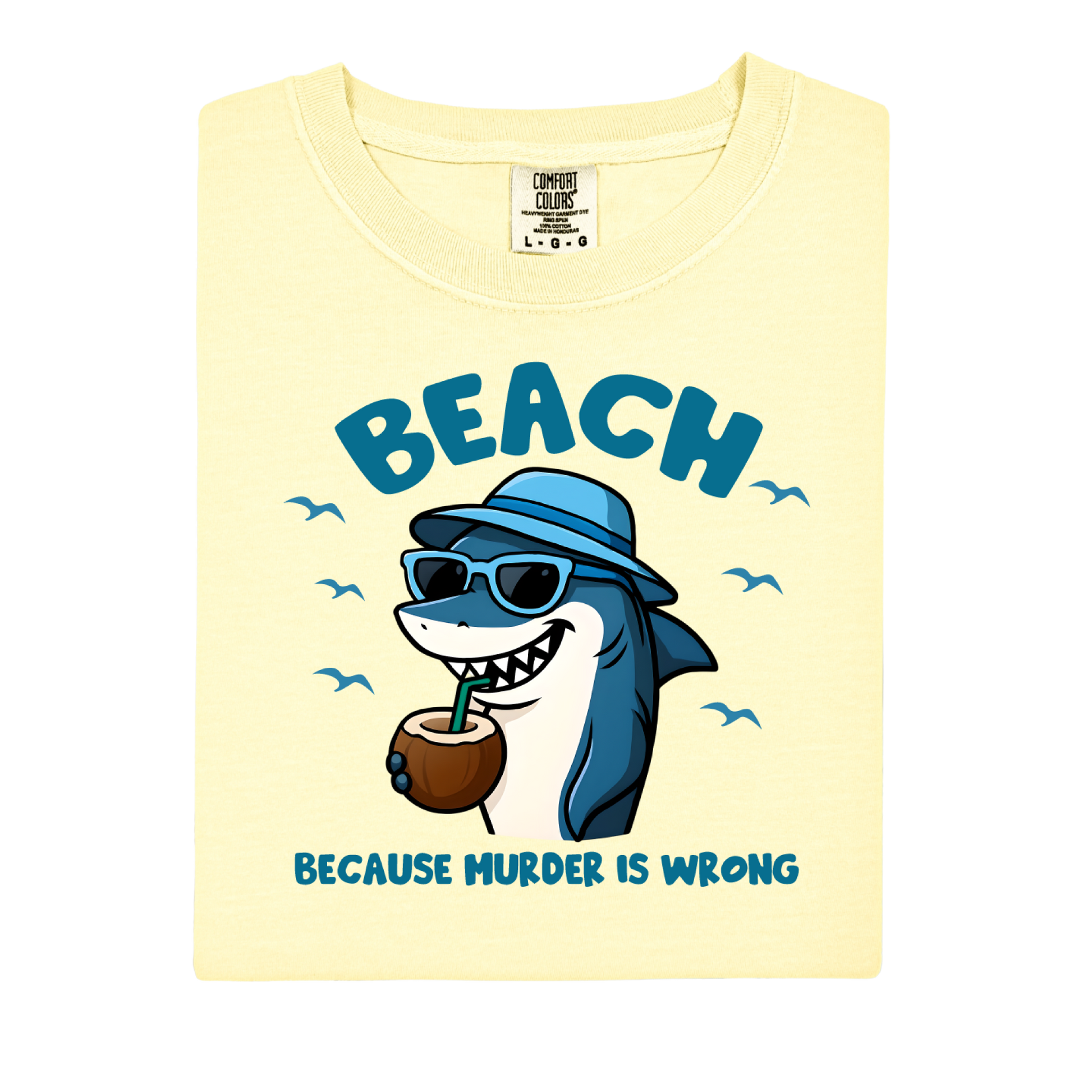 Shirt with a cartoon shark wearing sunglasses and a hat, holding a coconut, and text 'BEACH BECAUSE MURDER IS WRONG' on a light yellow background.