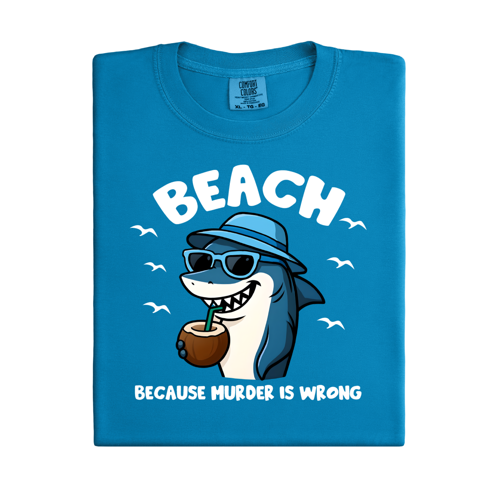 Blue t-shirt with a cartoon shark design and text on a white background