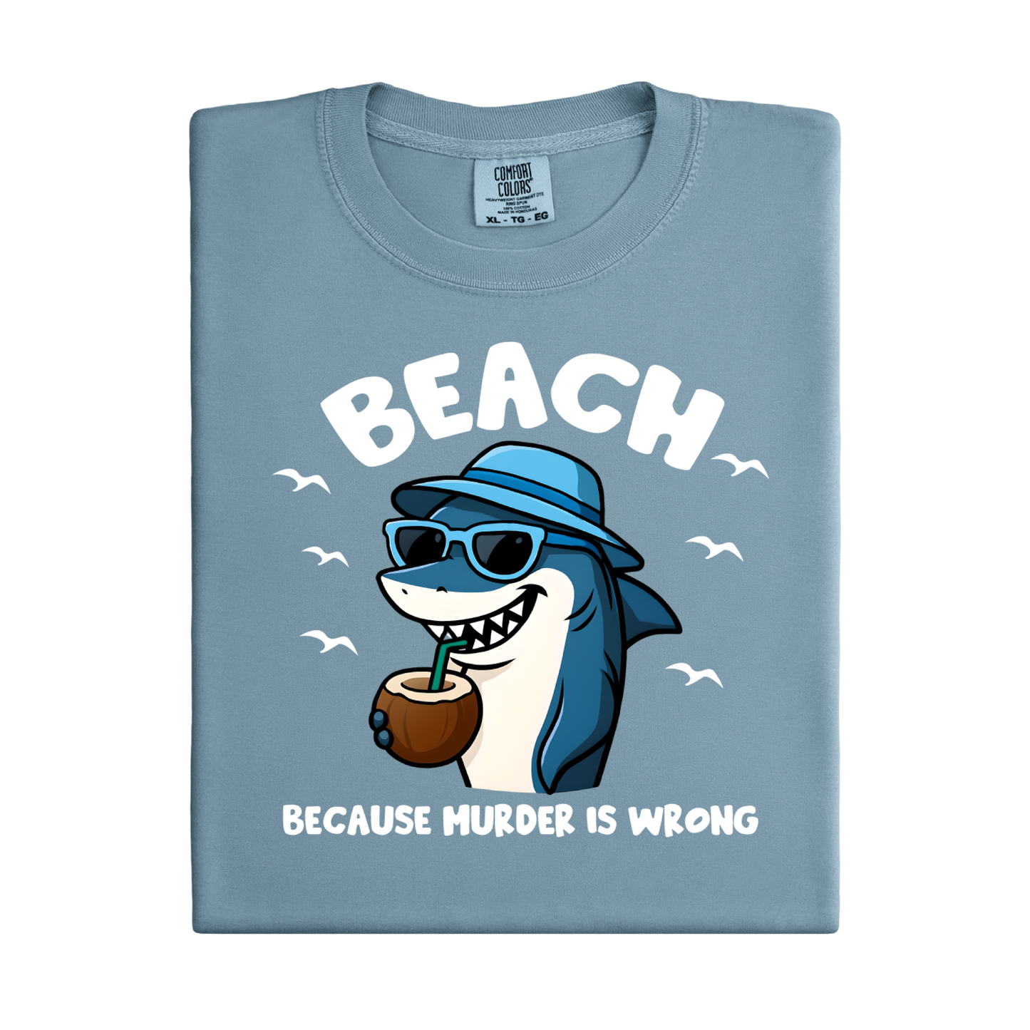 Light blue t-shirt with a shark graphic and text on a white background