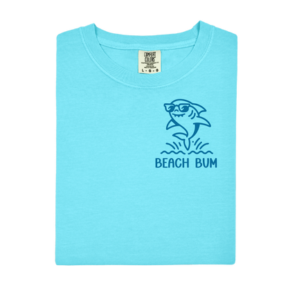 Light blue t-shirt with a shark graphic and 'Beach Bum' text on a white background