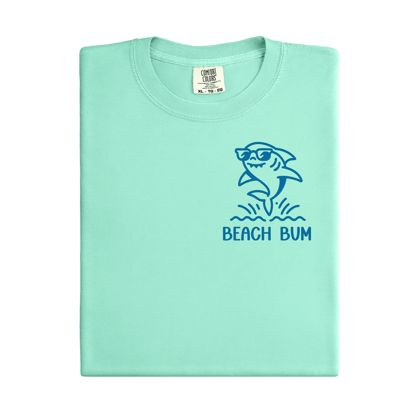 Light green t-shirt with a shark graphic and 'Beach Bum' text on a white background