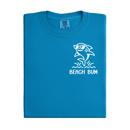 Blue t-shirt with a shark graphic and 'Beach Bum' text on a white background