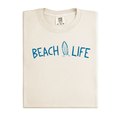 Ivory t-shirt with 'BEACH LIFE' text and surfboard graphic on a white background