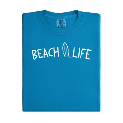 royal Caribe Blue t-shirt with 'Beach Life' text and surfboard graphic on a white background
