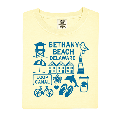 Yellow t-shirt with blue graphics and text about Bethany Beach, Delaware on a white background.