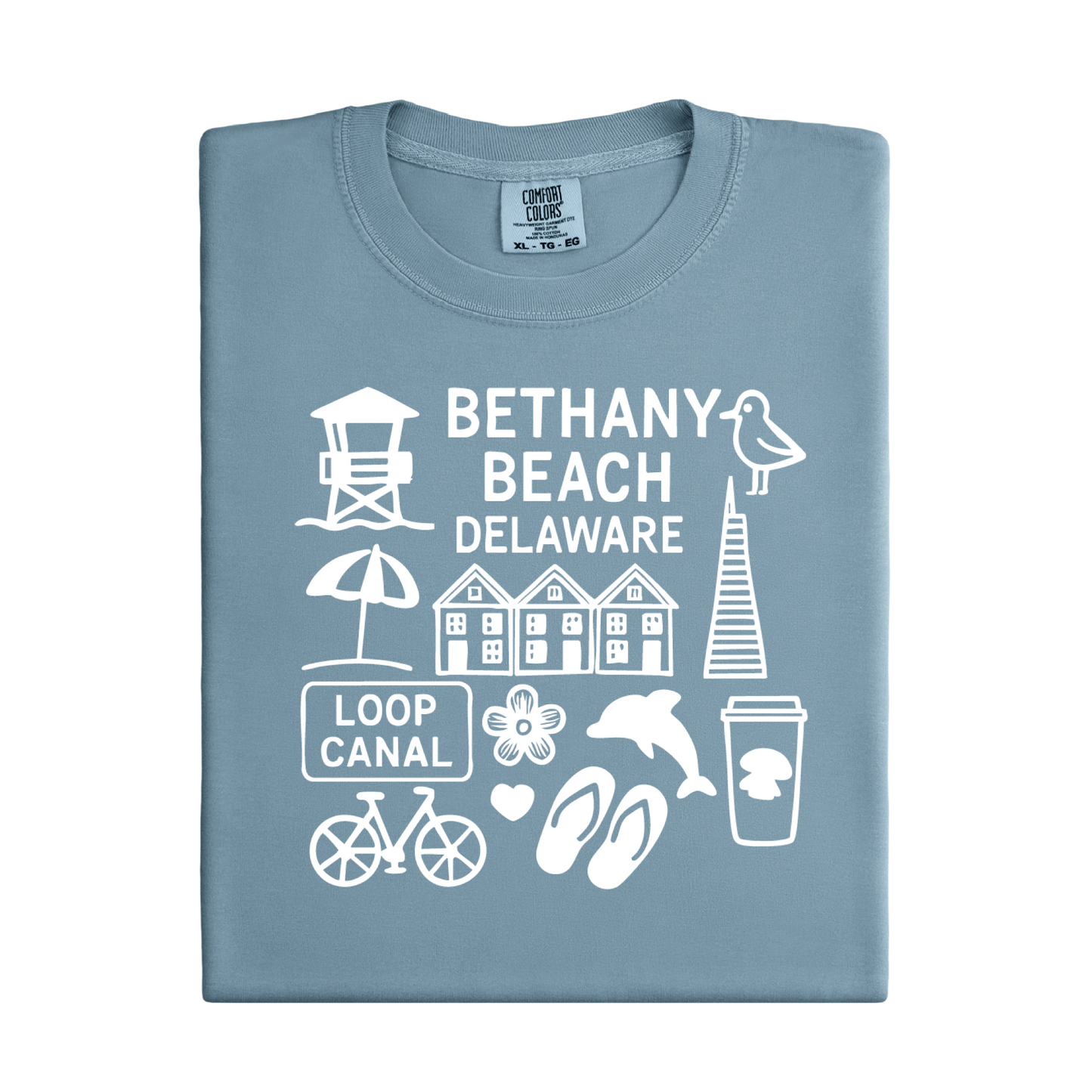 Folded blue t-shirt with white graphics and text about Bethany Beach, Delaware.