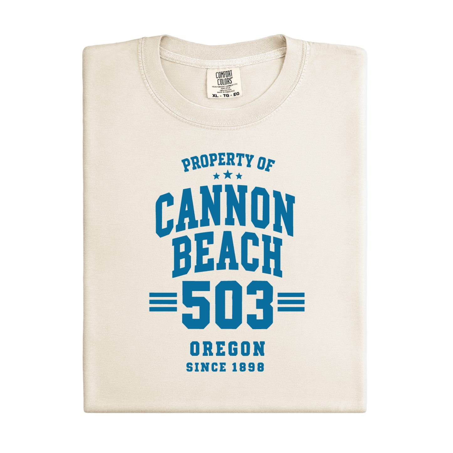 Folded t-shirt with 'Property of Cannon Beach 503 Oregon Since 1898' text on a white background