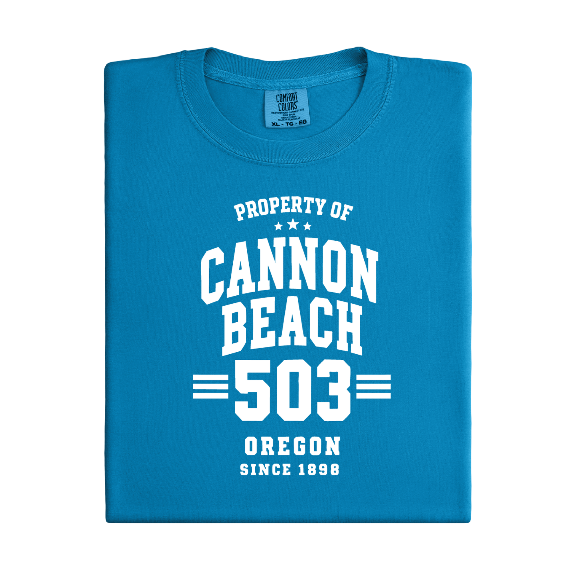 Blue t-shirt with white text 'Property of Cannon Beach 503 Oregon Since 1899' on a white background