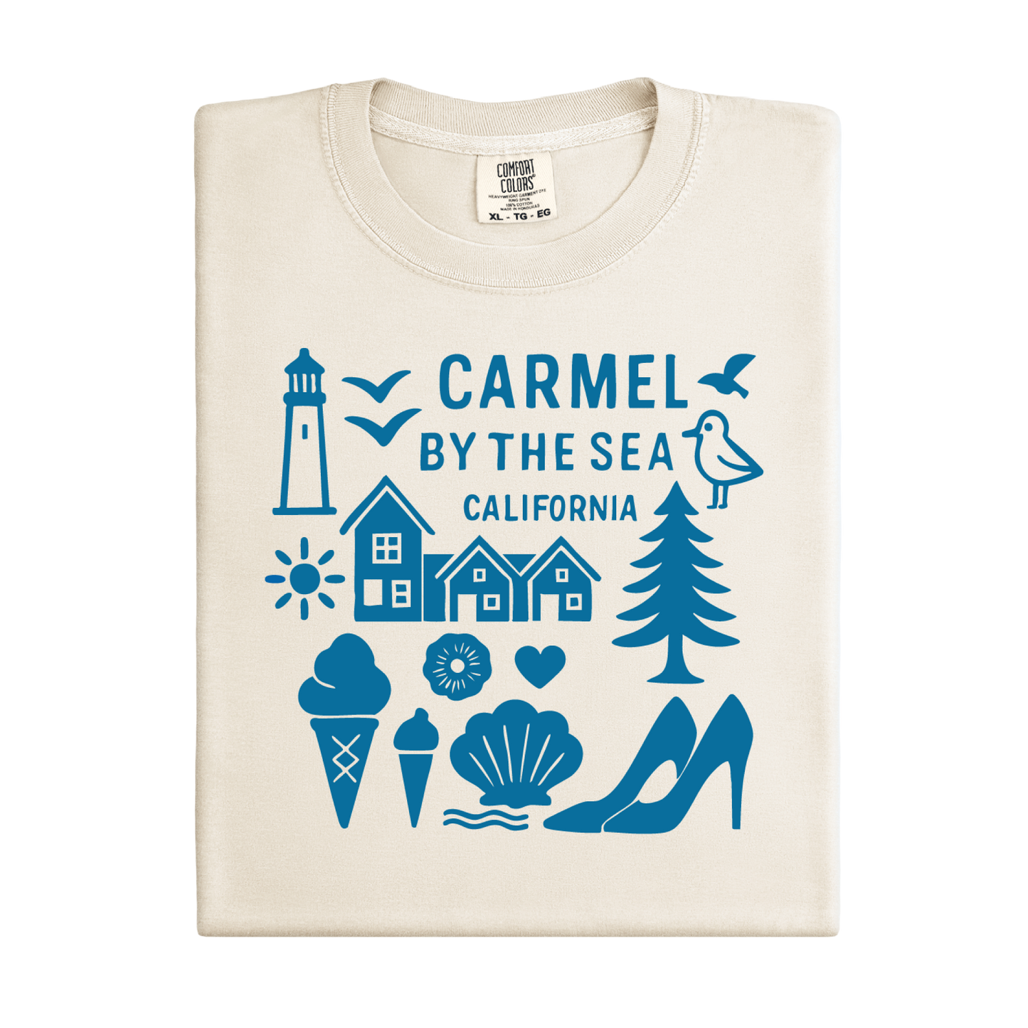 Beige t-shirt with blue graphics and text 'Carmel by the Sea, California' on a white background