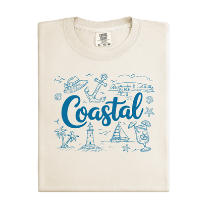 Ivory t-shirt with blue coastal-themed graphics and text on a white background