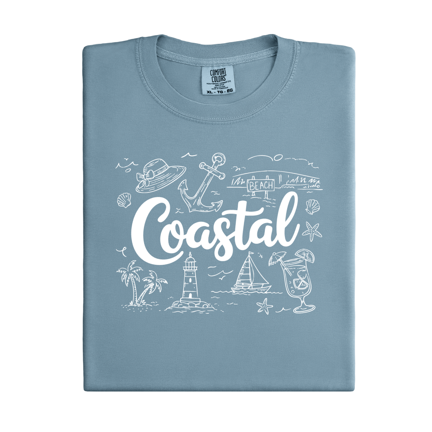 Folded light blue t-shirt with 'Coastal' design on a white background