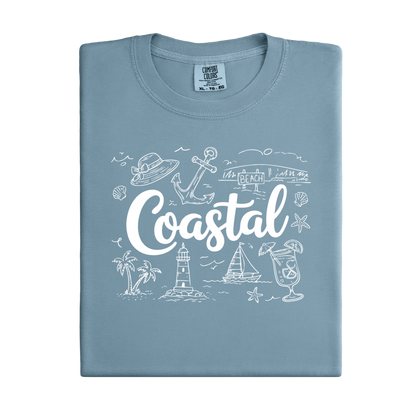 Folded light blue t-shirt with 'Coastal' design on a white background