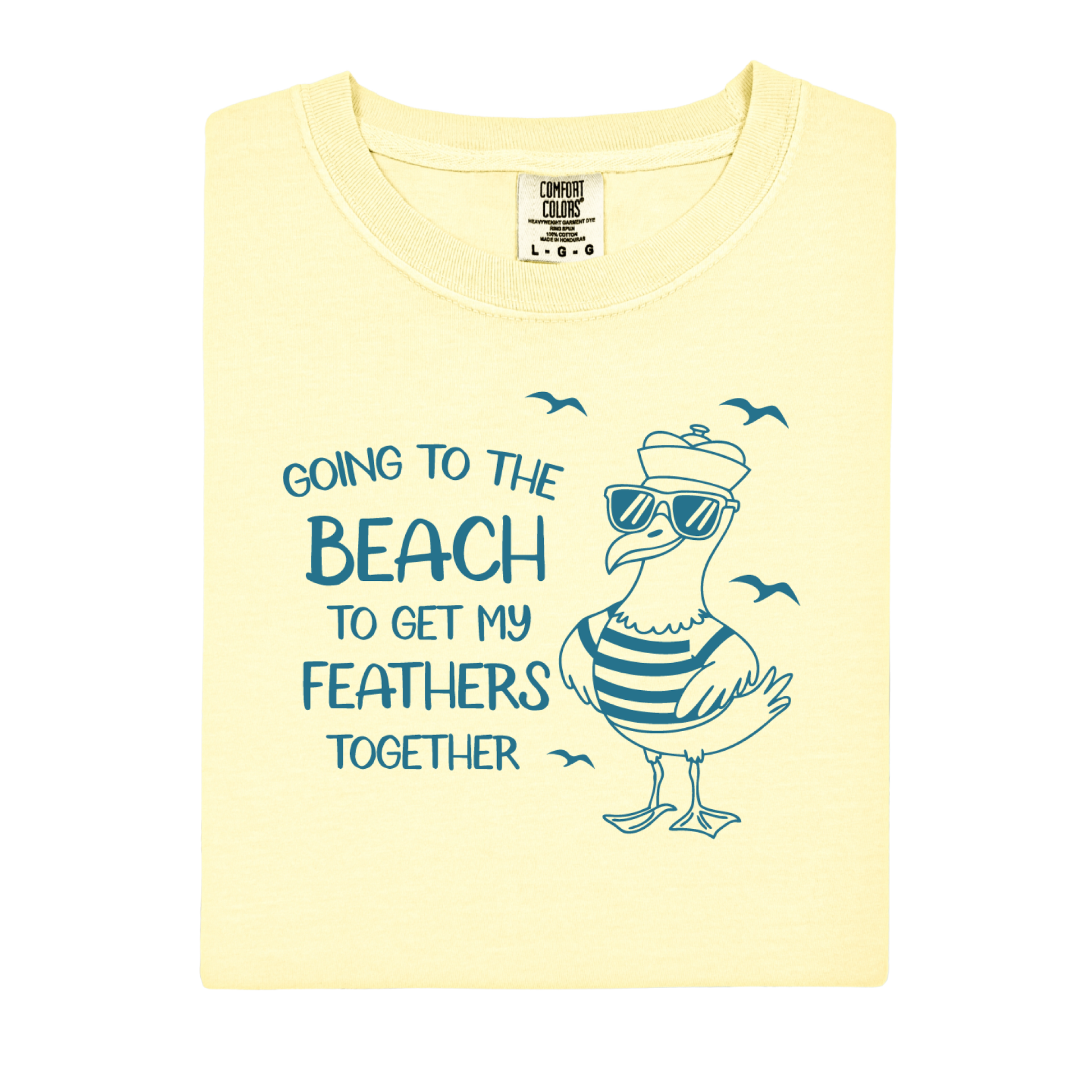 Comfort Colors t-shirt featuring a humorous blue seagull graphic wearing sunglasses and a striped shirt, beside the text “Going to the Beach to Get My Feathers Together.” Several flying birds surround the design, adding a fun coastal feel. This unisex garment-dyed tee offers a soft, vintage texture and relaxed fit, perfect for beach lovers, ocean fans, and anyone who enjoys playful summer graphic shirts.