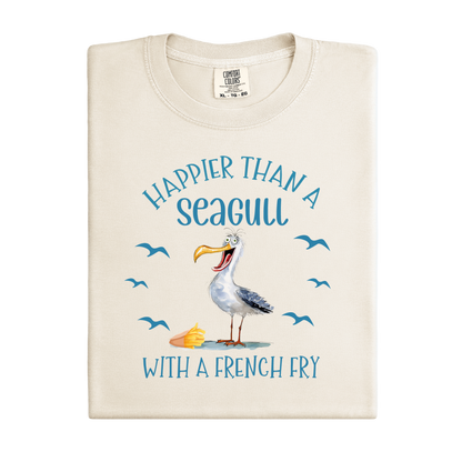 Beige t-shirt with a seagull graphic and text on a white background