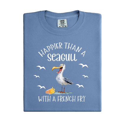 Folded blue t-shirt with a seagull graphic and text on a white background