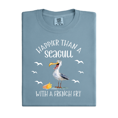 Folded blue t-shirt with a seagull graphic and text on a white background