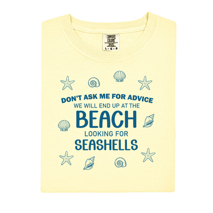 Yellow t-shirt with beach-themed text and graphics on a white background