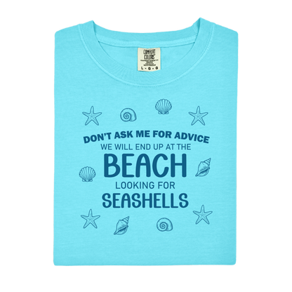 Light blue t-shirt with beach-themed text and graphics on a white background