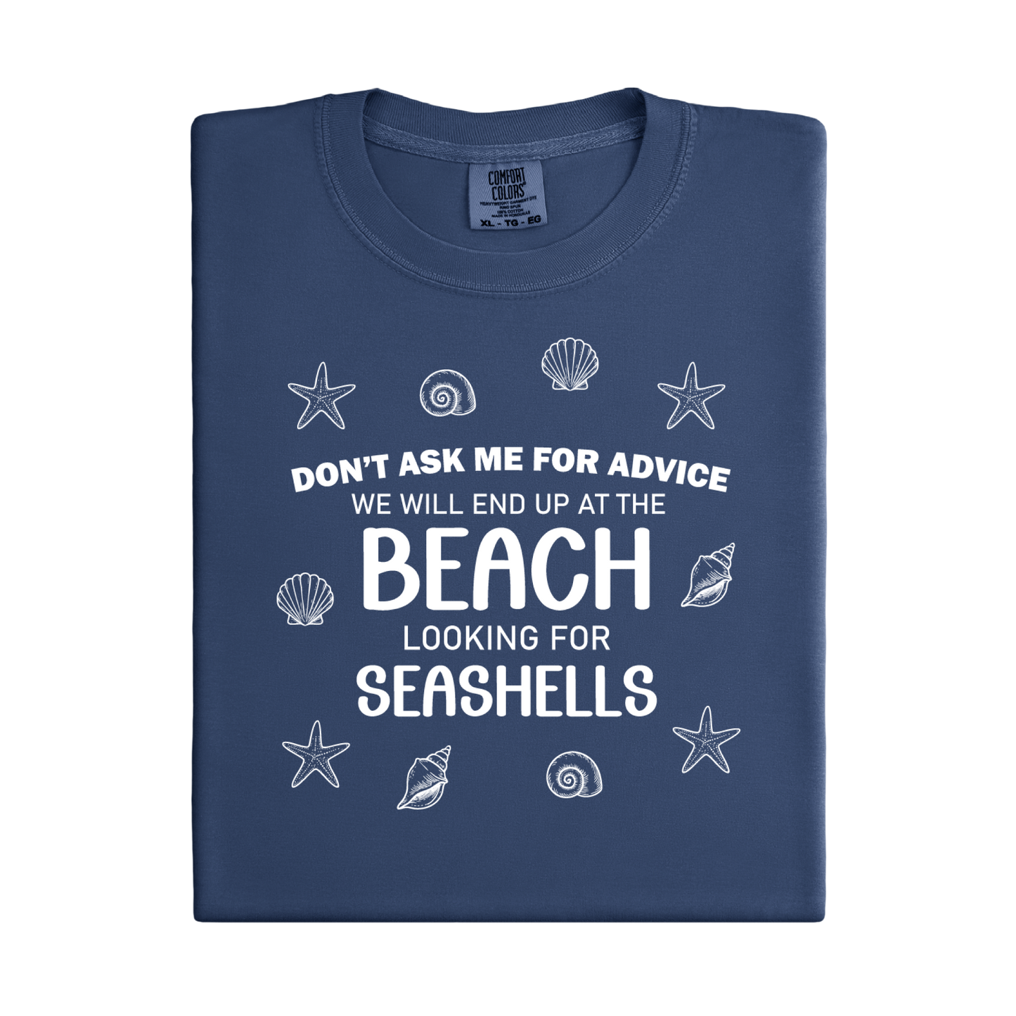 Folded navy blue t-shirt with beach-themed text and graphics on a white background