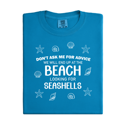 Blue t-shirt with white text and sea-themed graphics on a white background