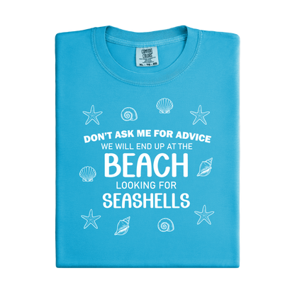 Blue t-shirt with beach-themed text and graphics on a white background