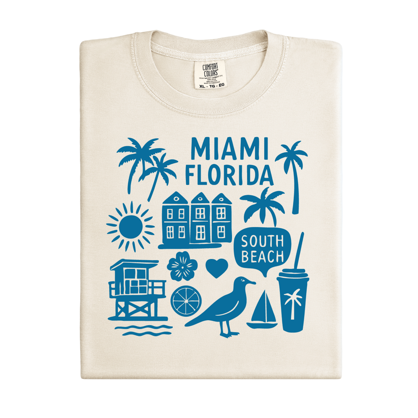 Beige t-shirt with blue Miami Florida graphics on a white background