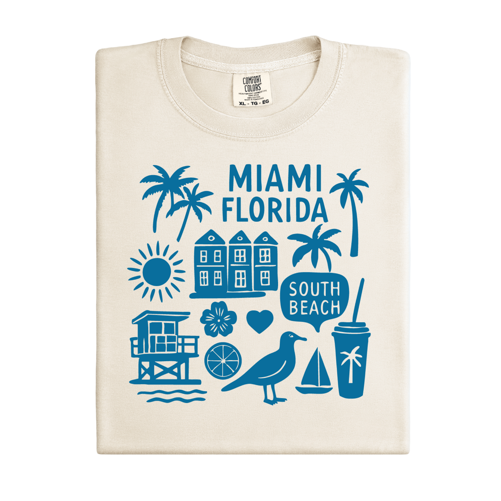 Beige t-shirt with blue Miami Florida graphics on a white background