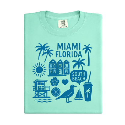 Light green t-shirt with blue Miami Florida graphics on a white background