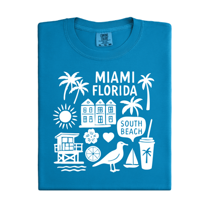 Blue t-shirt with white Miami Florida graphics on a white background
