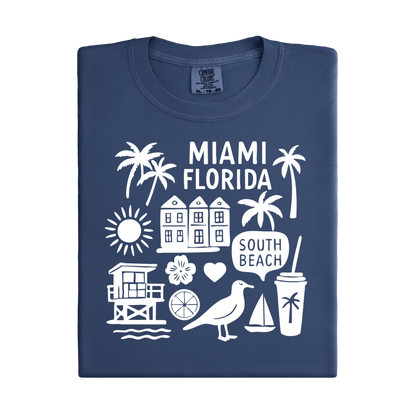 Folded navy blue t-shirt with white Miami Florida graphics on a white background