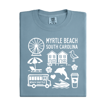Folded blue t-shirt with white graphics and text about Myrtle Beach, South Carolina.