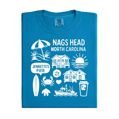 Blue t-shirt with white graphics and text about Nags Head, North Carolina on a white background