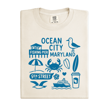 Beige t-shirt with blue graphics and text on a white background