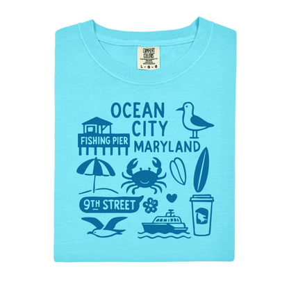 Light blue t-shirt with Ocean City, Maryland-themed graphics on a white background