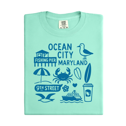 Light green t-shirt with Ocean City, Maryland-themed graphics on a white background
