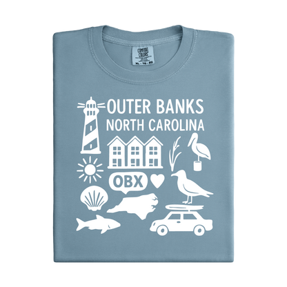 Folded blue t-shirt with white Outer Banks North Carolina graphics on a white background