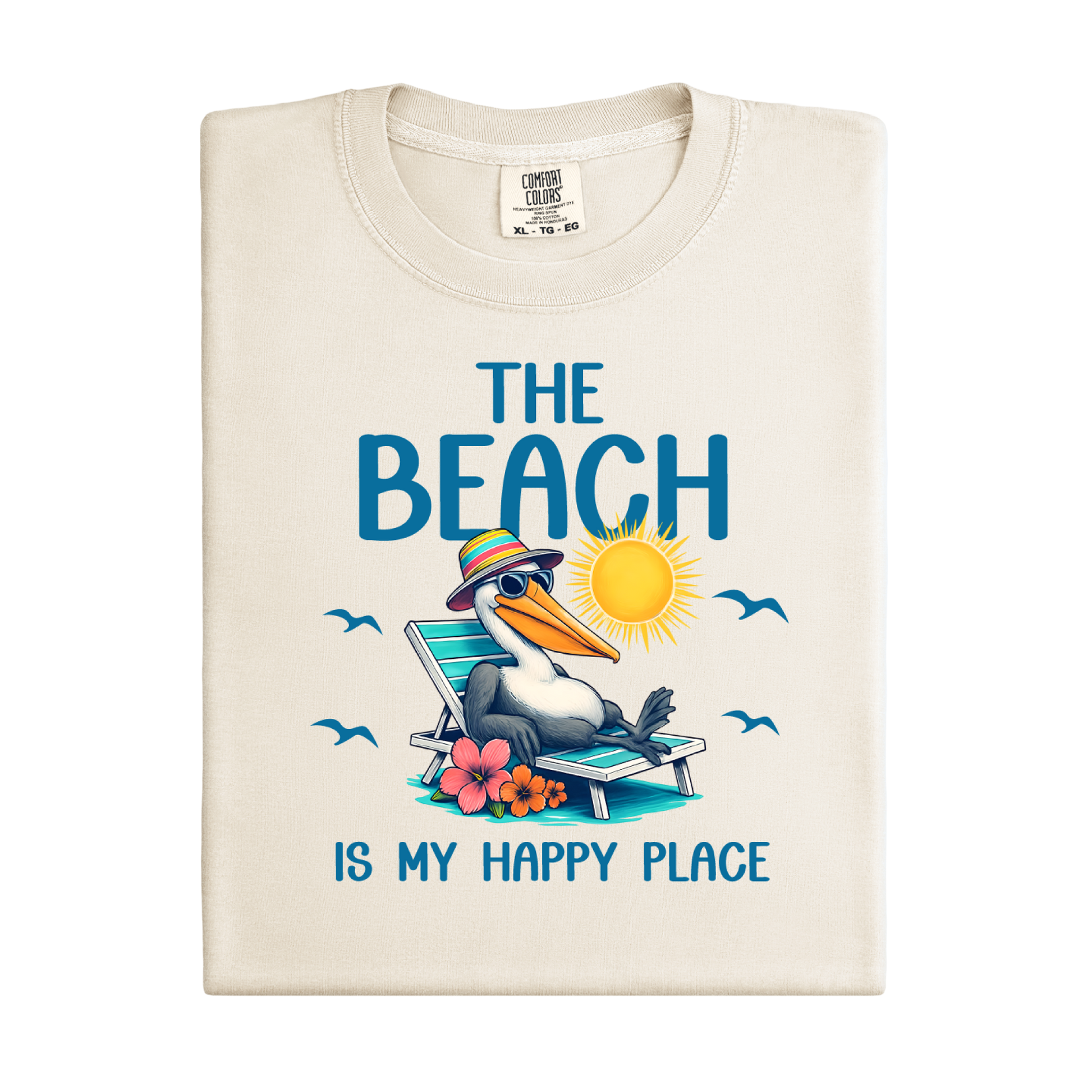 Folded t-shirt with a pelican graphic and text 'The Beach is my happy place' on a white background