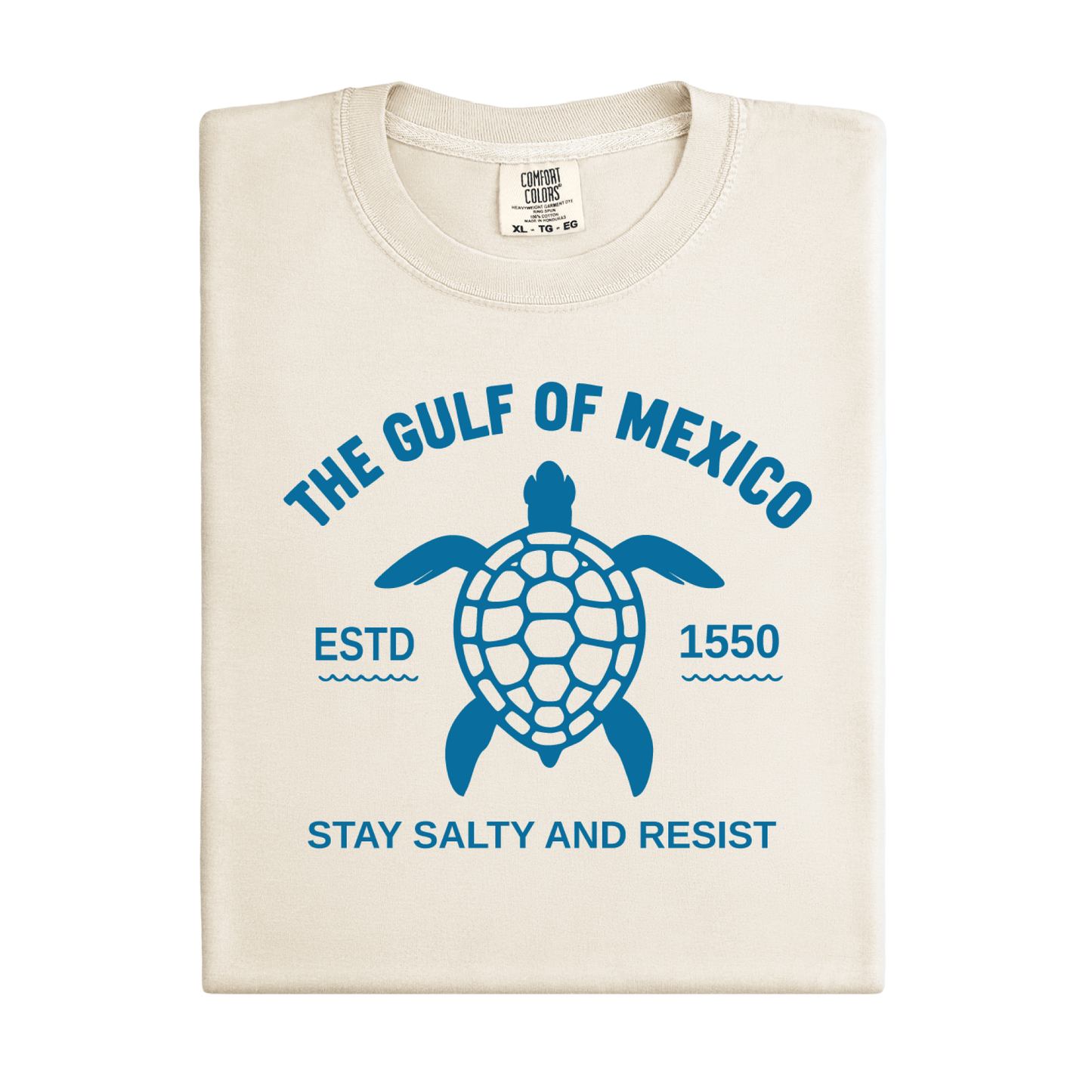 Beige t-shirt with blue turtle graphic and text on a white background