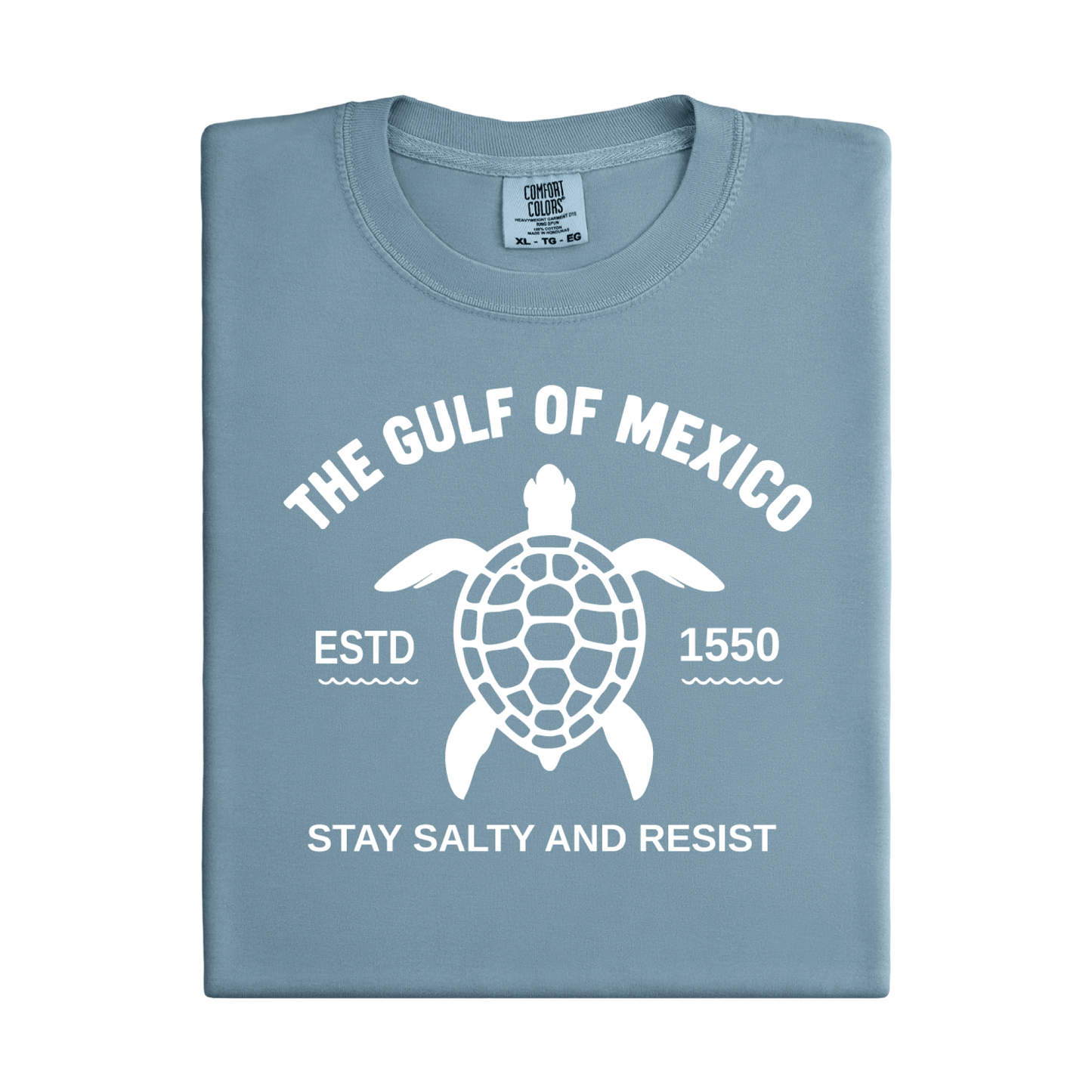 Folded blue t-shirt with turtle graphic and text on a white background