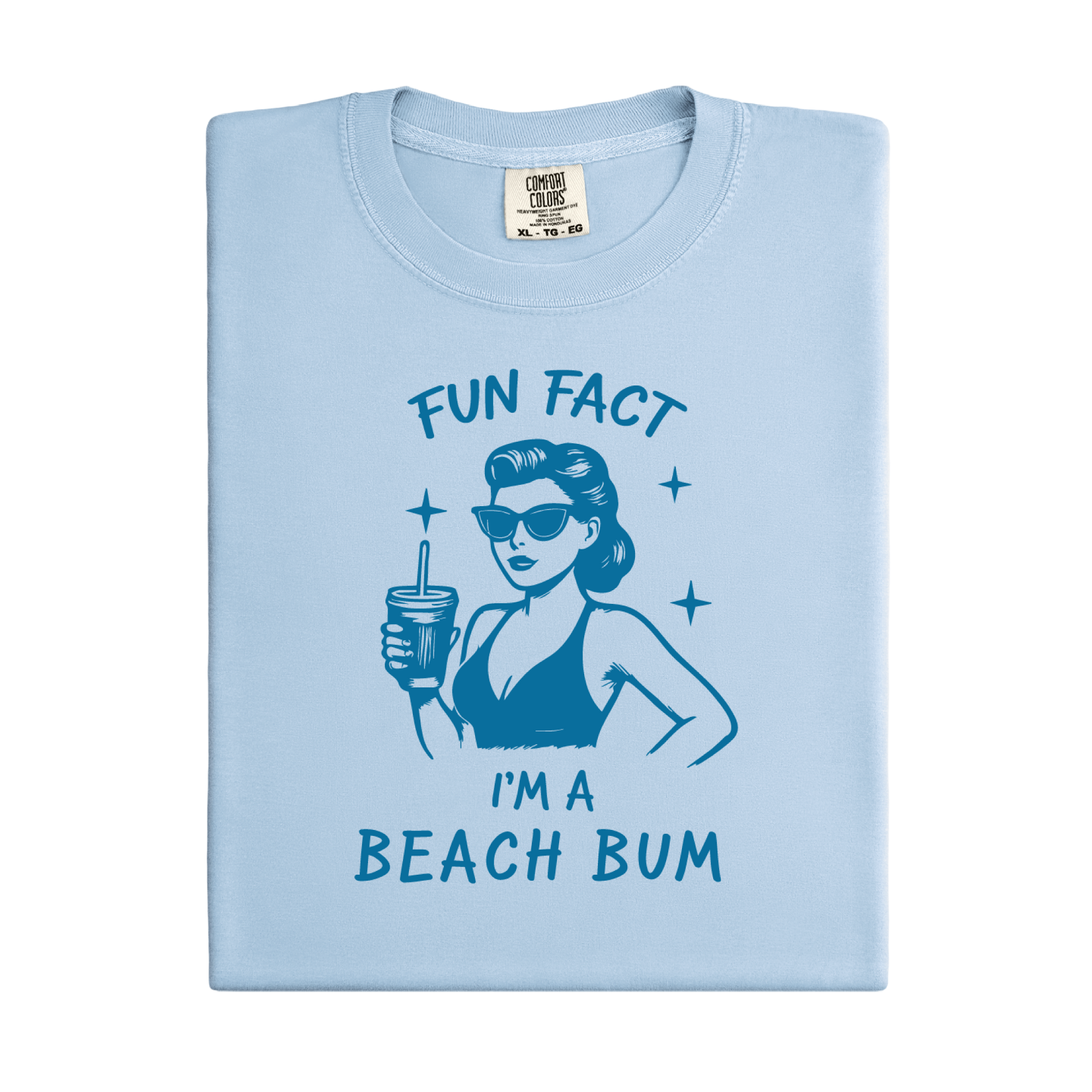 Light blue t-shirt with a graphic of a woman in a bikini and sunglasses, holding a drink, with text 'Fun Fact I'm a Beach Bum' on a white background.